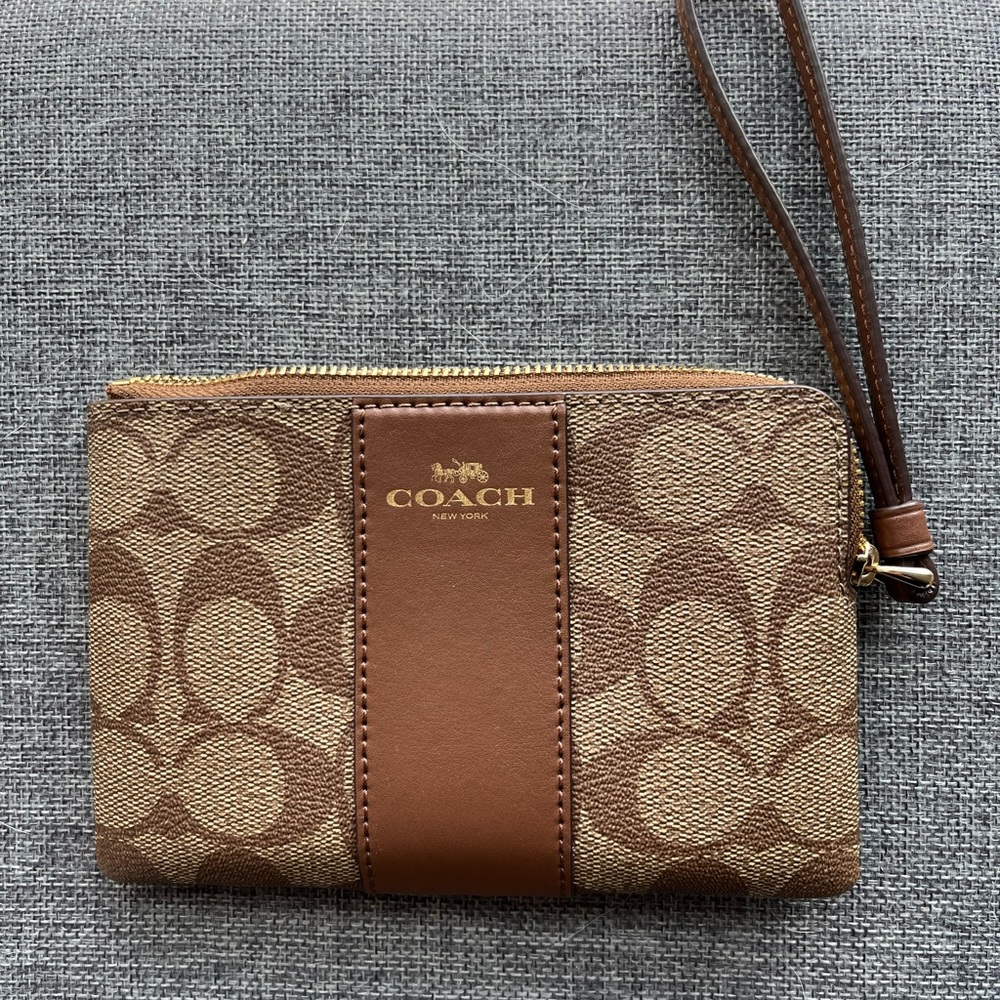 Coach dark brown and tan wristlet/wallet